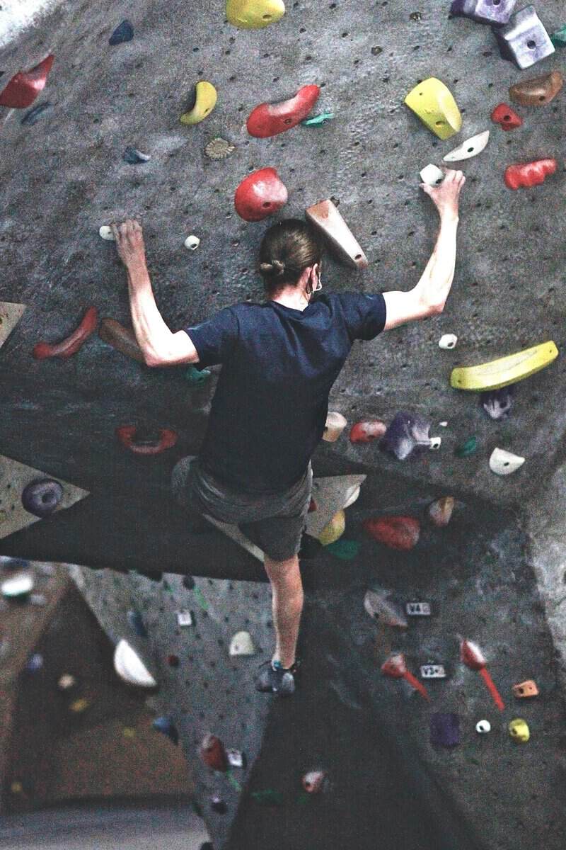 Climber working up the bouldering wall