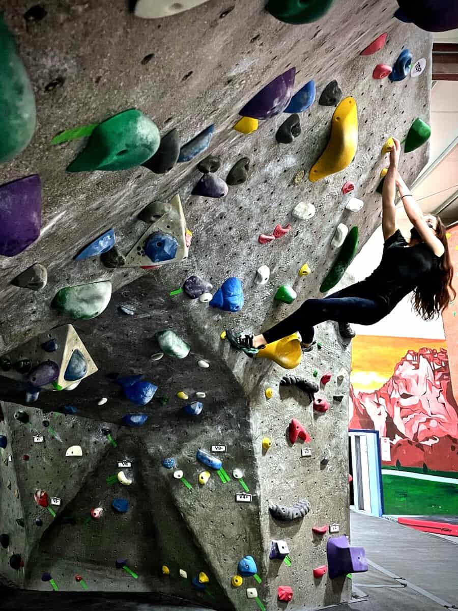Climber high on a roped route